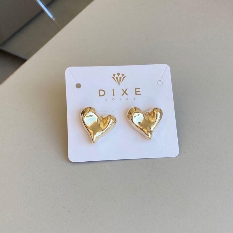 Brinco organico coralçao torto martelado