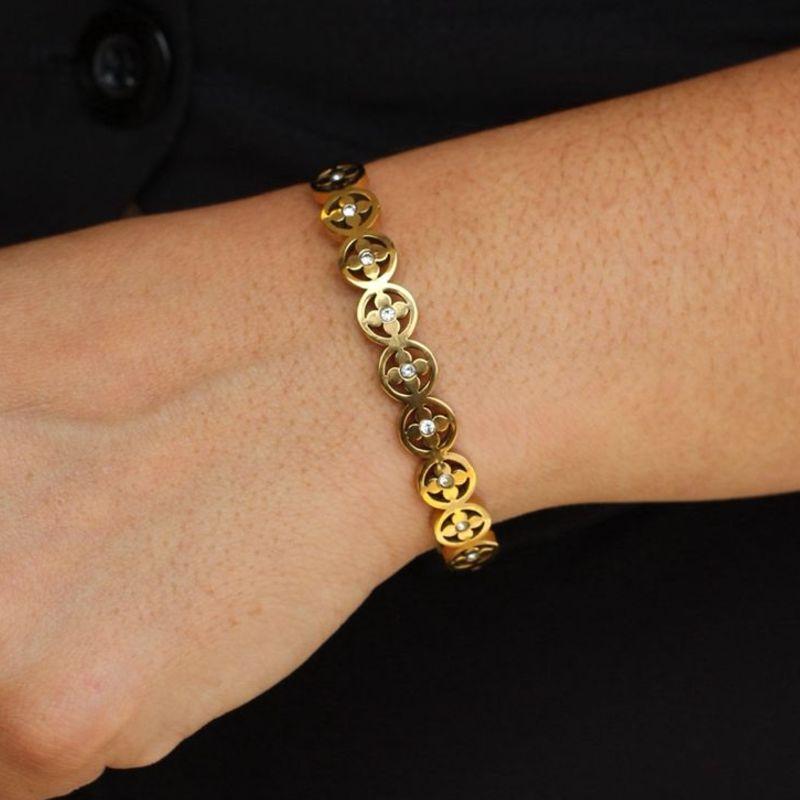Bracelete Flores aço dourado
